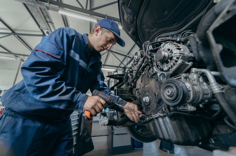 Auto mechanic repairs an engine replacing the timing chain