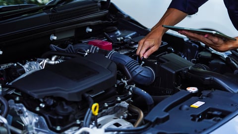 Mechanic hands using wrench to repair auto engine